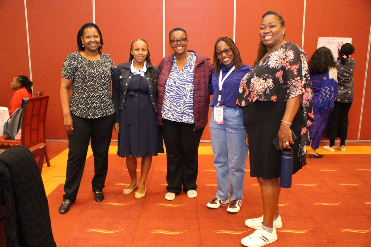 Left-AWSC-Team-Right-Strathmore-Team-with-their-Coach-Ms.-Wairu-Kinyori-at-WiL-CoP-Convening-in-Naivasha